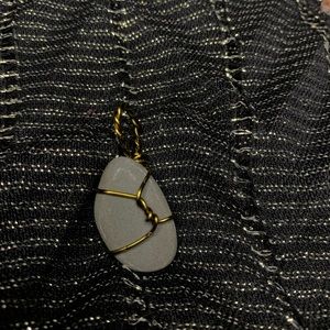 Basalt wire wrapped rock pendent.